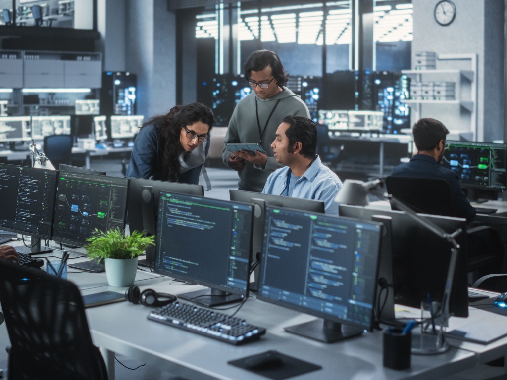 Three employees working together.