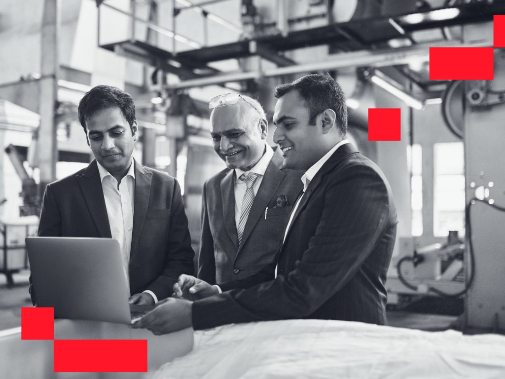 Employees with their Employer discussing business strategies.