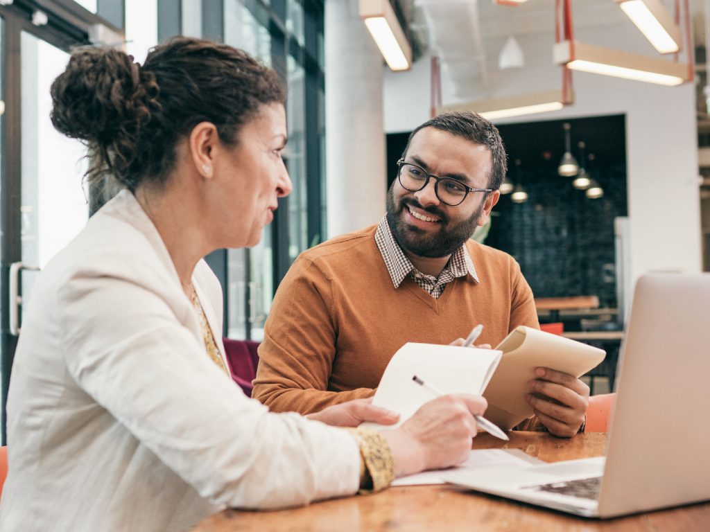 A leader discussing work with the employee.